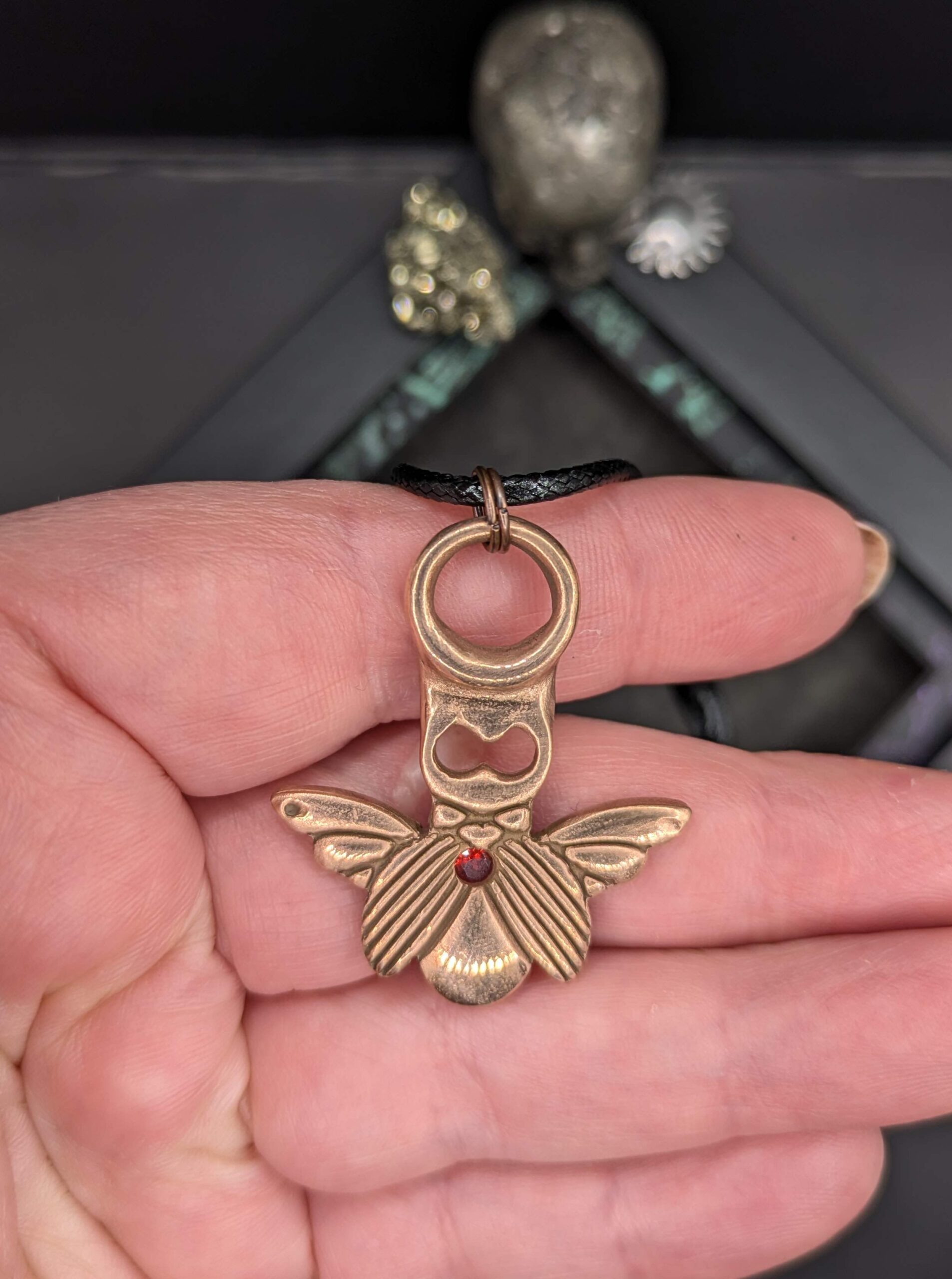 Bronze scarab pendant with red cubic zirconia stone